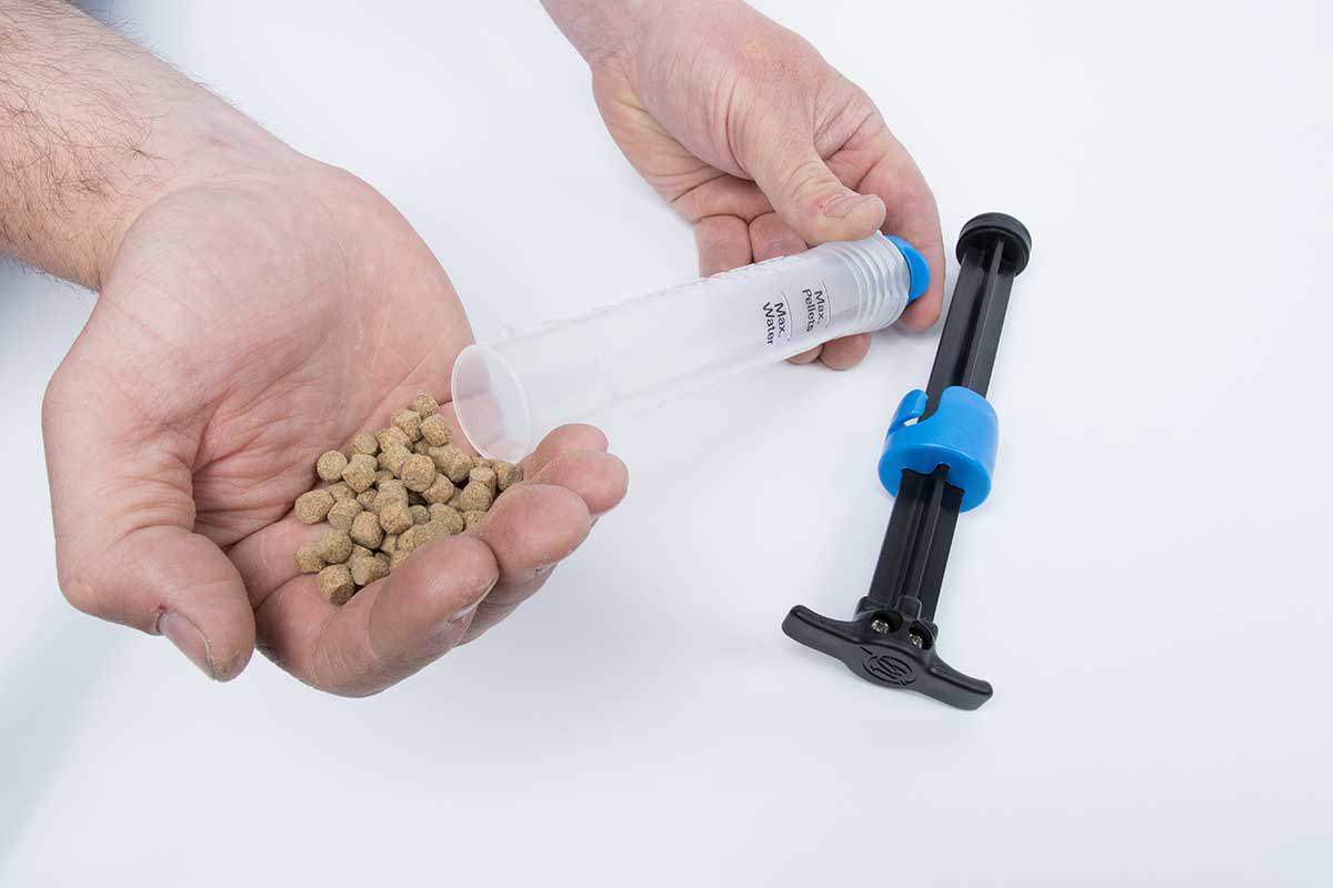 Remove plunger and add any quantity of pellets up to the line marked 'Max. Pellets'