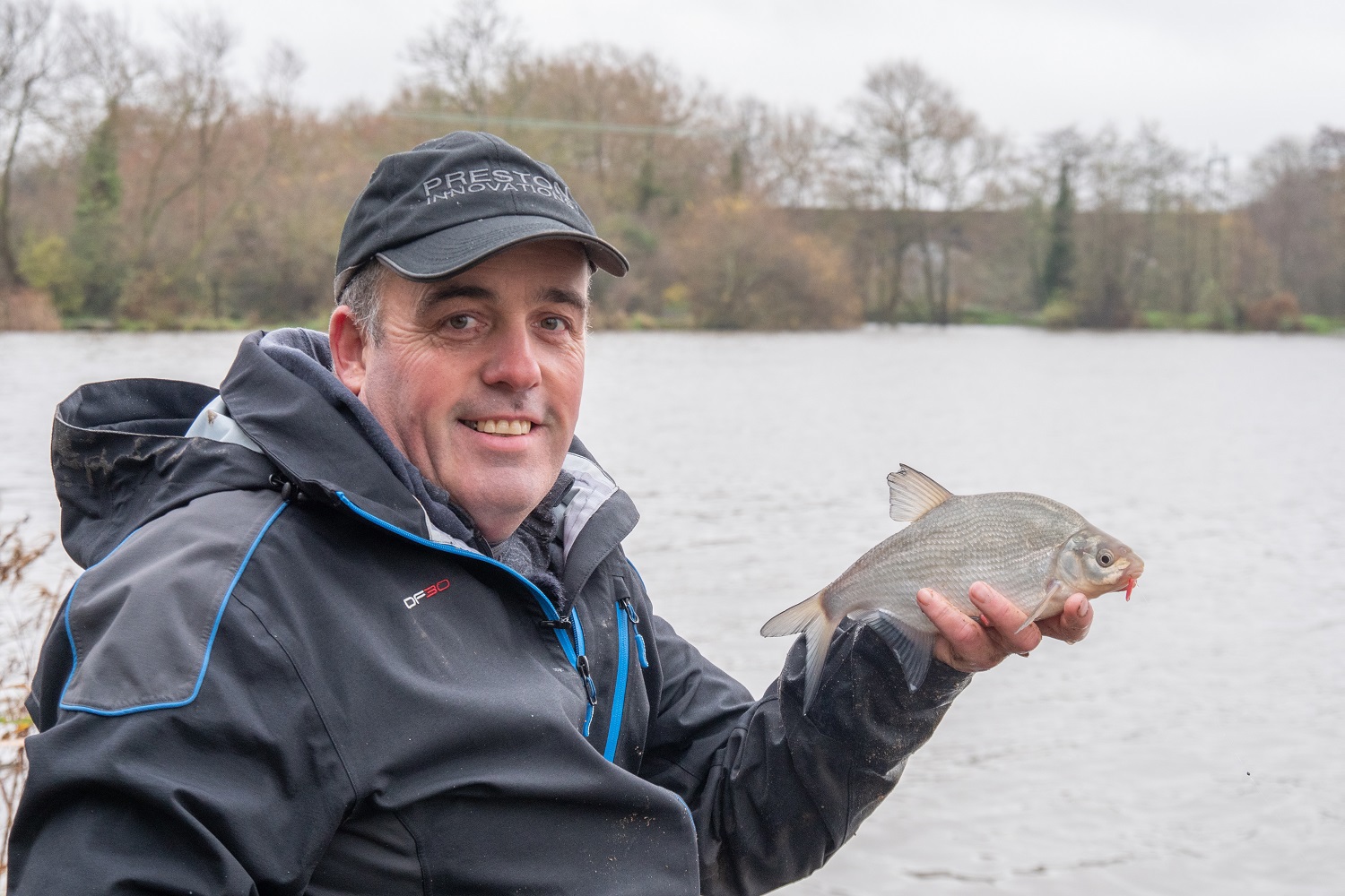 Des Shipp holding up a fish he just caught